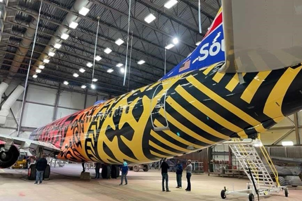 The coating process of the tail of the aircraft.