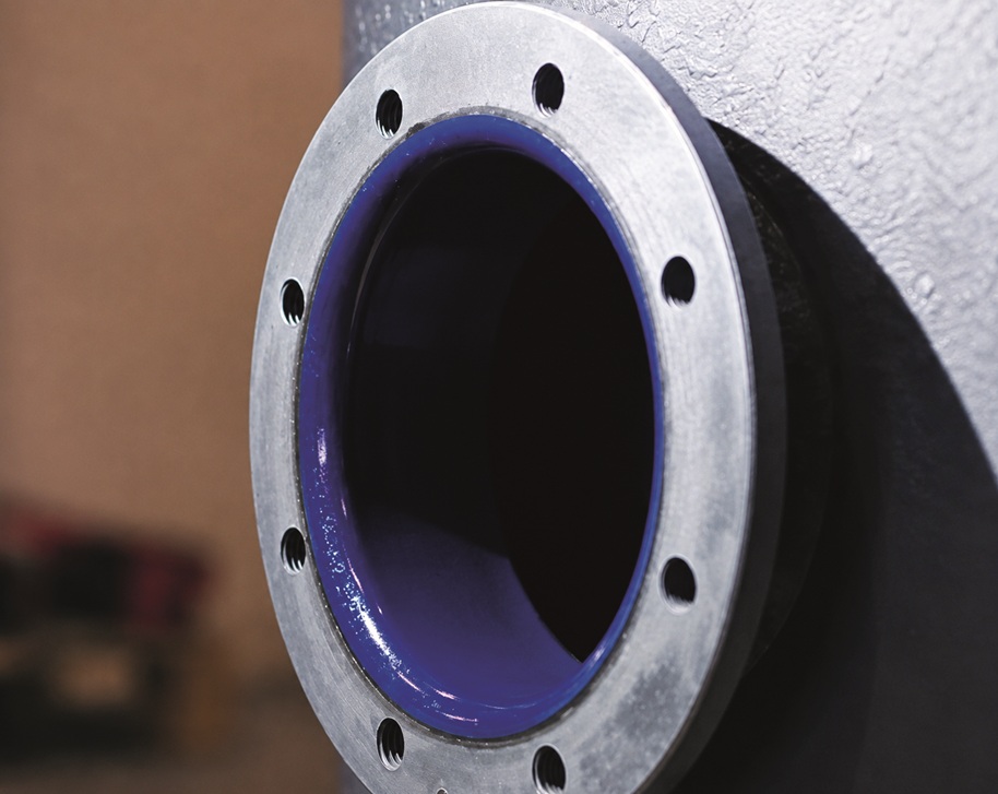 The boilers reach the in-line automatic application machines, where two flow coaters apply the liquid porcelain enamel.