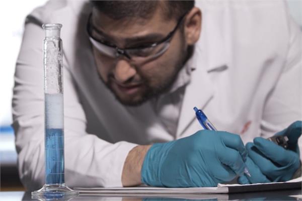 A technician of Dow in a lab testing chemicals