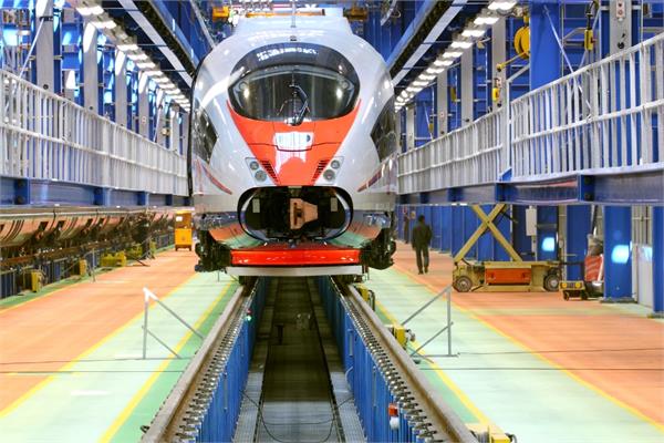 photo of a train coated in red and white