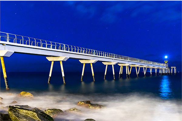 A bridge over a river at night