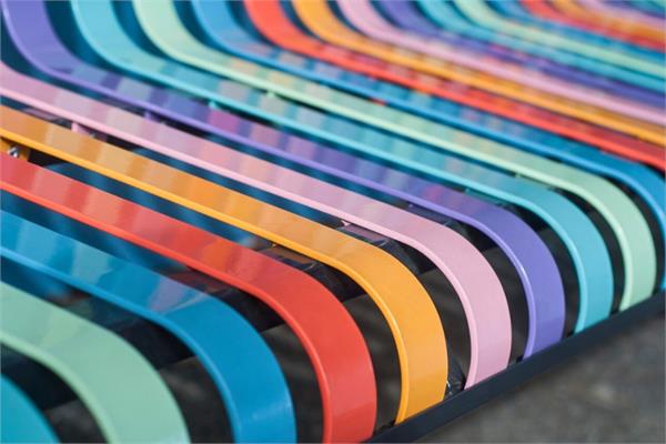 A photo that shows a bench coated in various colours with BASF coatings