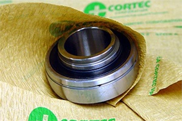 A small metal part with inside the VpCI-146 Creped paper  packaging of Cortec