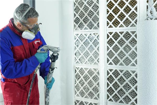 photo of an operator applying the new coating developed by Hempel