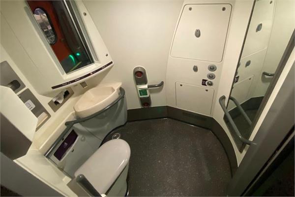 The inside of the toilet in a train