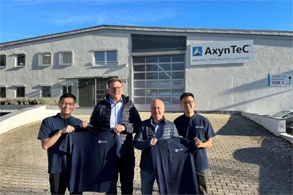 a photo of the representatives of Nanofilm and AxynTec