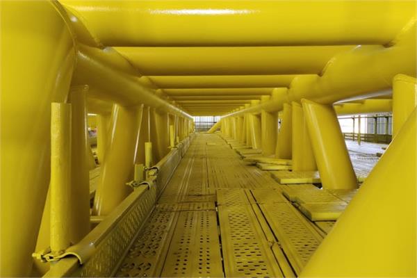 A yellow steel structures protected by coatings with the Proshield+ paint additive