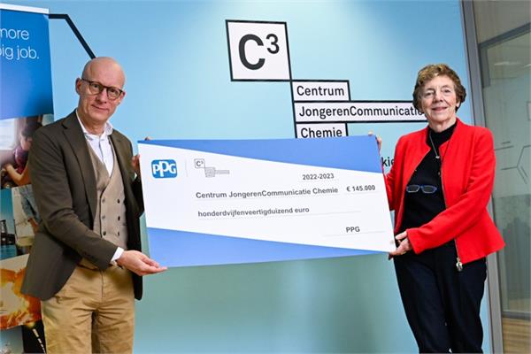 PPG representative handing the cheque to support  education