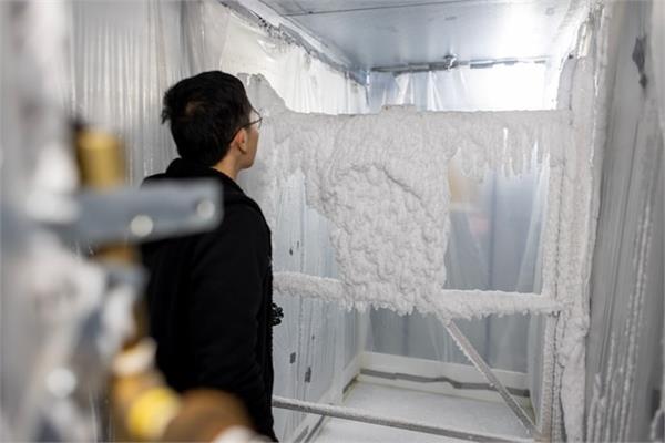 A wind turbine covered in ice