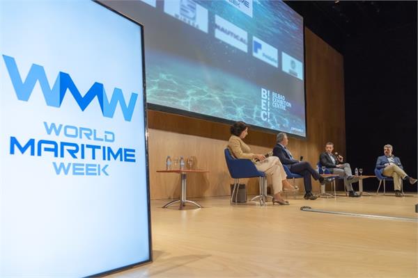 Four people discussing on the stage of a forum during the last World Maritime Week