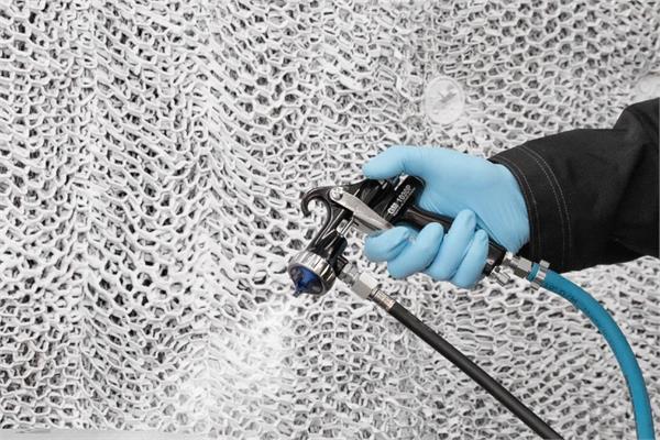 Manual zinc flake coating spray application